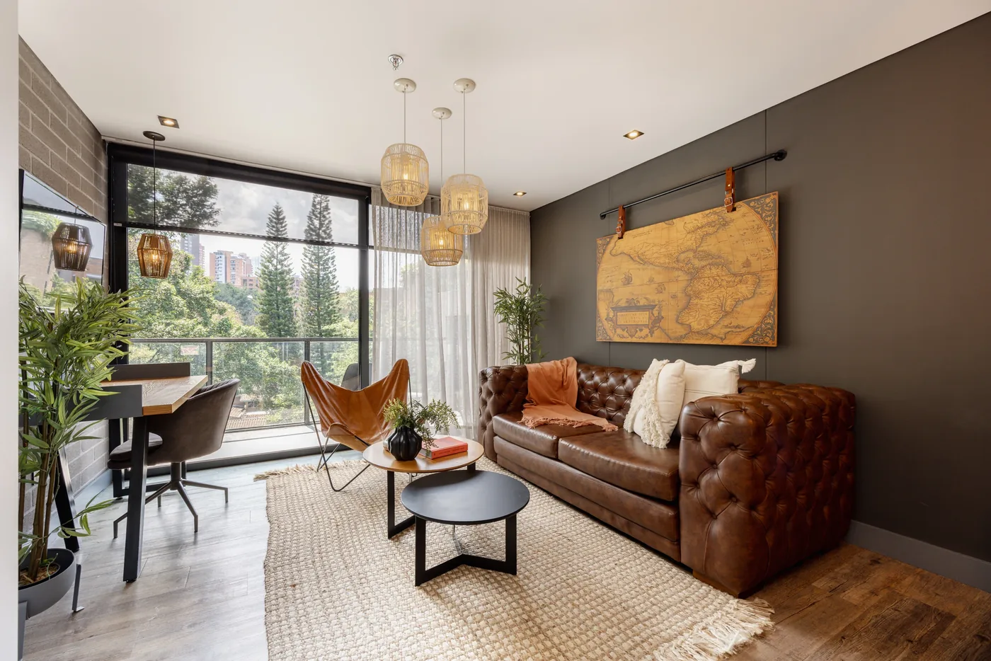 Living room with balcony in a two-bedroom furnished apartment at Loma Verde, Medellín
