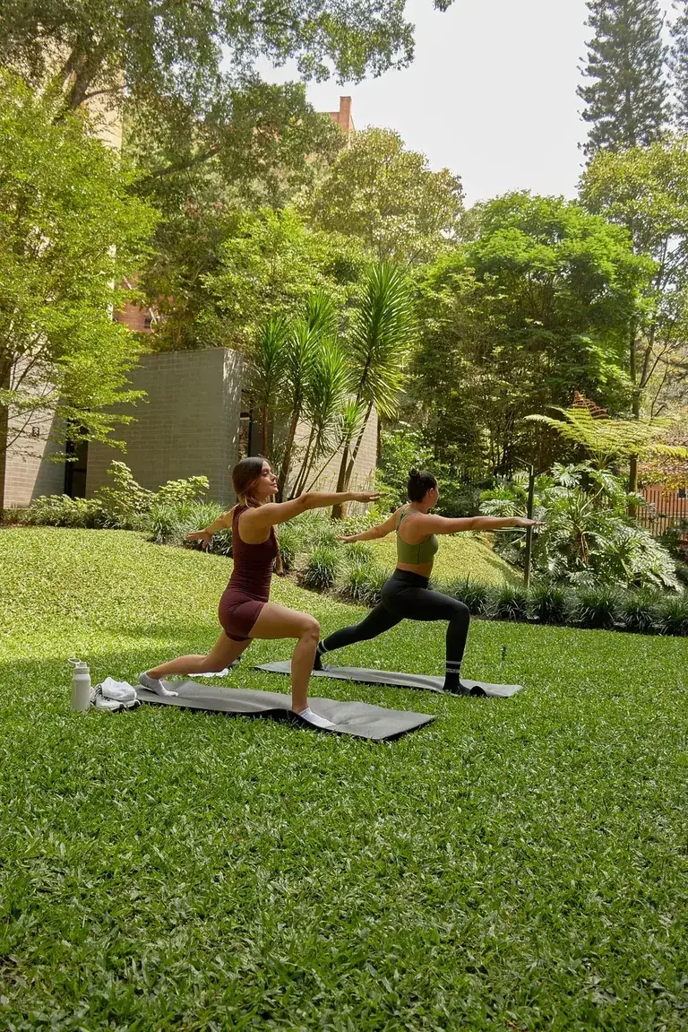Morning yoga on the lawn in the green areas of Loma Verde, El Poblado, Medellín