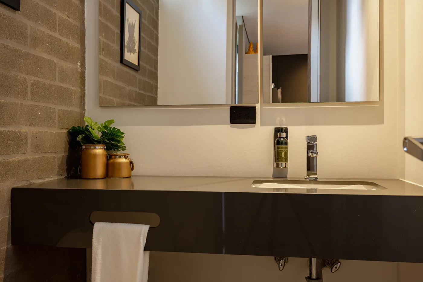 Bathroom vanity in a one-bedroom furnished apartment at Loma Verde, Medellín