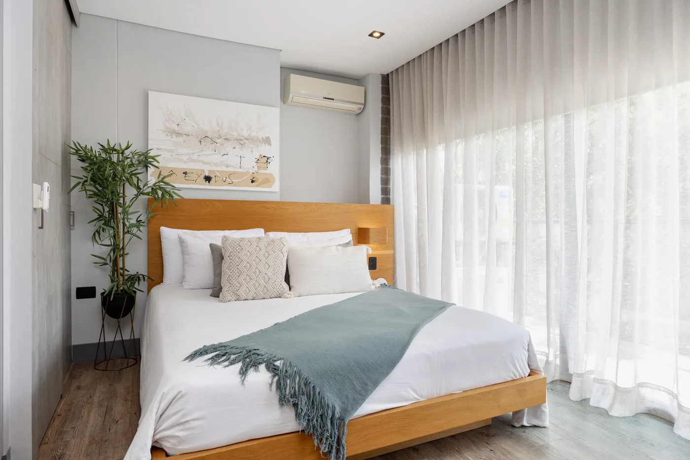 King bedroom with balcony in a two-bedroom furnished apartment at Loma Verde, Medellín
